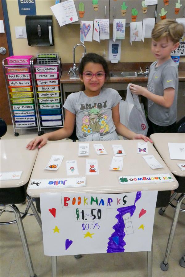 girl selling bookmarks
